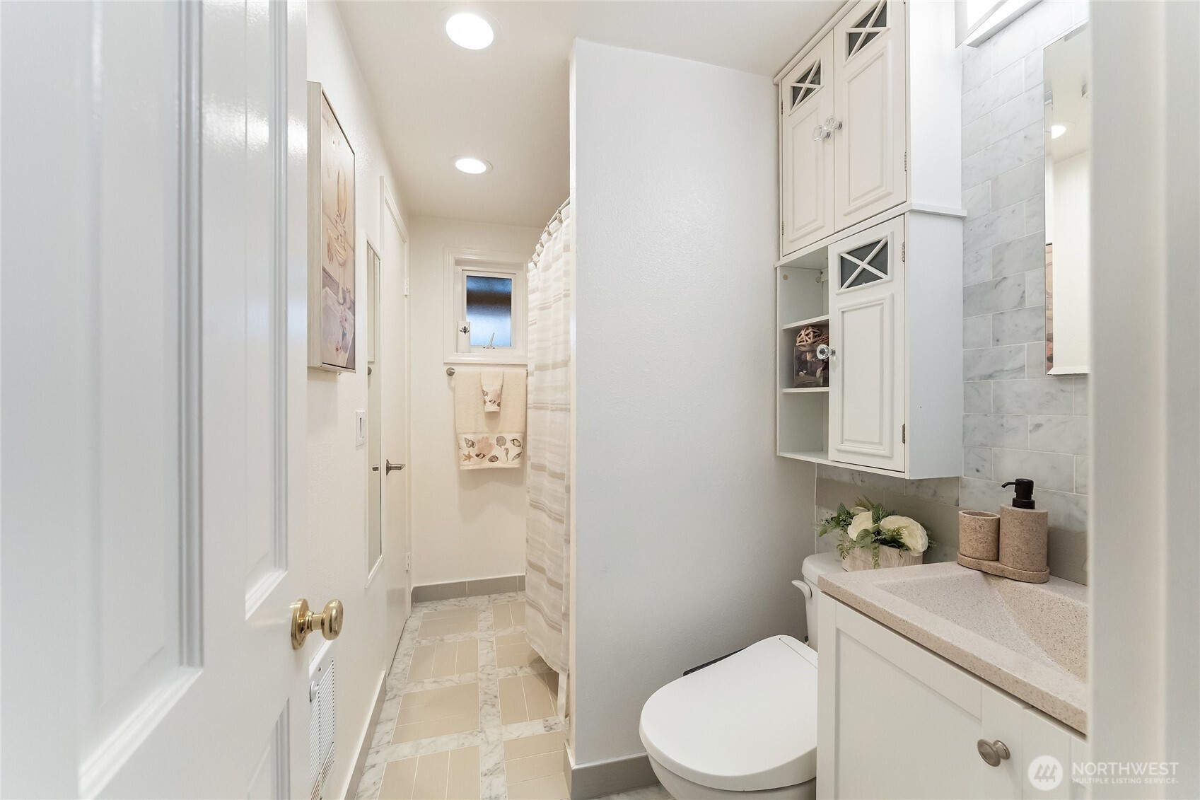10107 Meridian Avenue Everett, WA 98208 - Photo 17 of 26 a bathroom with a sink a toilet and shower