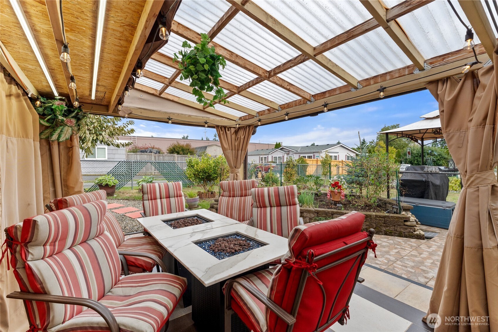 10107 Meridian Avenue Everett, WA 98208 - Photo 18 of 26 a view of a patio with couches table and chairs