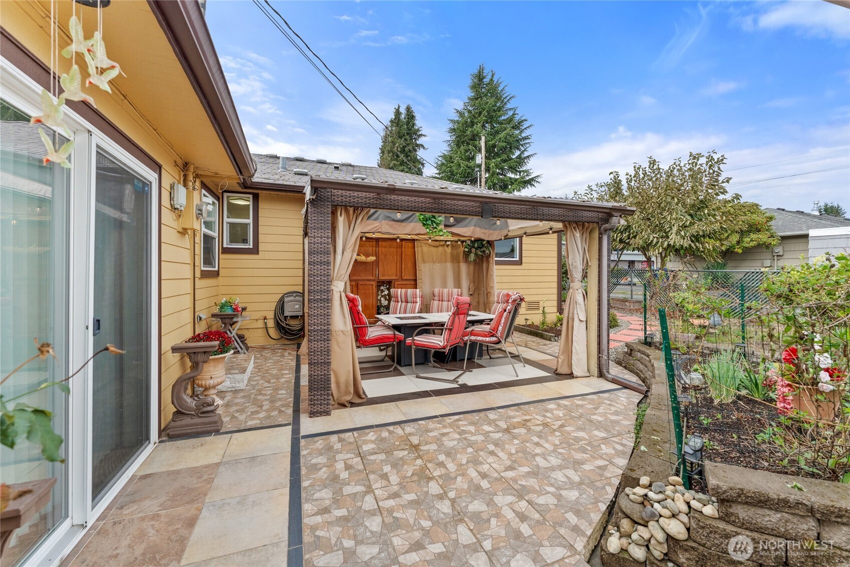 10107 Meridian Avenue Everett, WA 98208 - Photo 20 of 26 a view of a porch with furniture and a yard