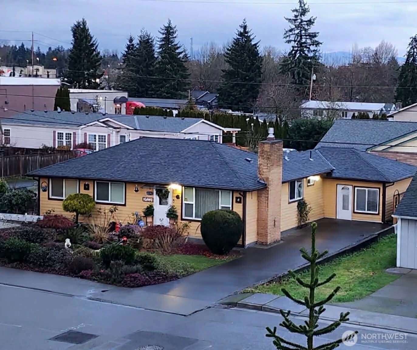 10107 Meridian Avenue Everett, WA 98208 - Photo 2 of 26 a house view with a garden space