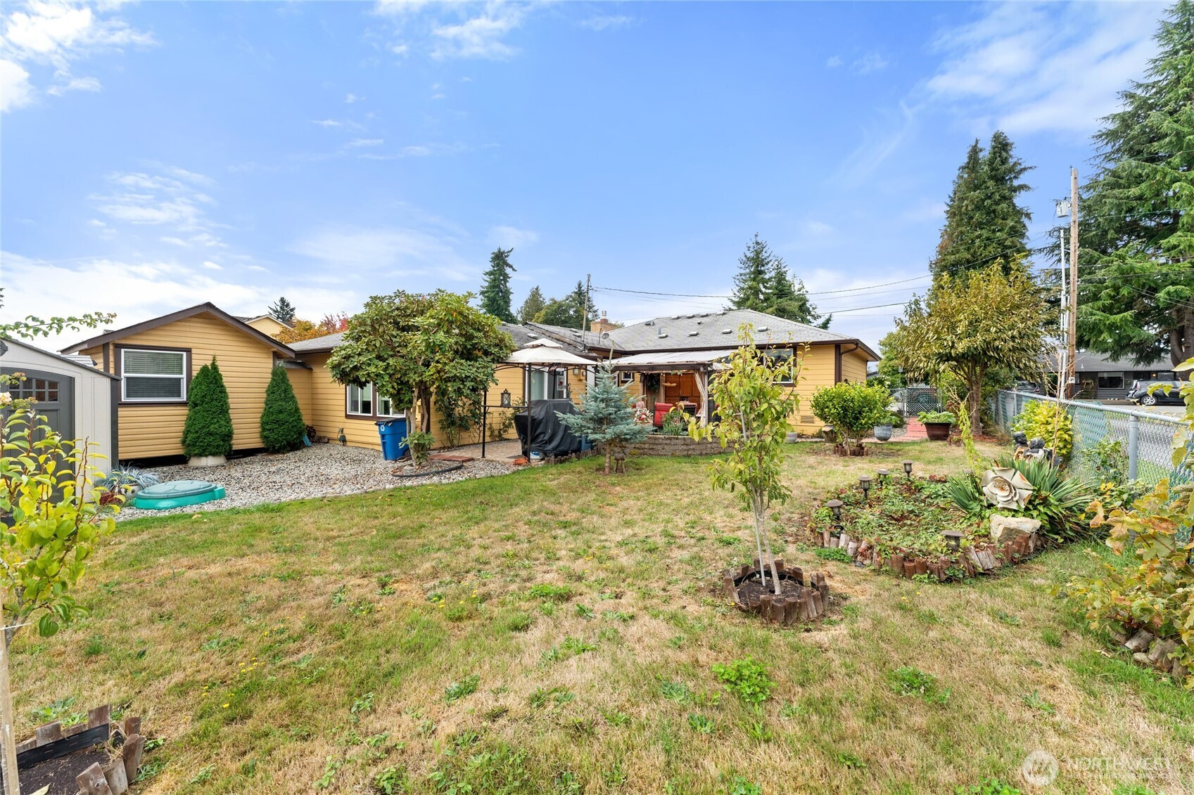 10107 Meridian Avenue Everett, WA 98208 - Photo 22 of 26 a view of a house with a yard