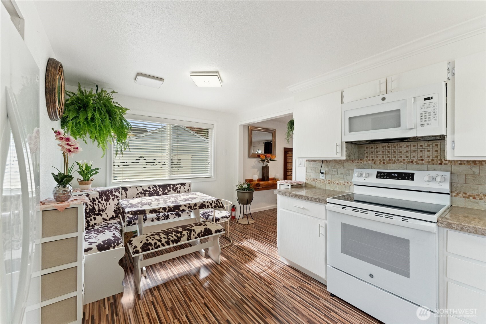10107 Meridian Avenue Everett, WA 98208 - Photo 4 of 26 a kitchen with a stove a sink and a refrigerator