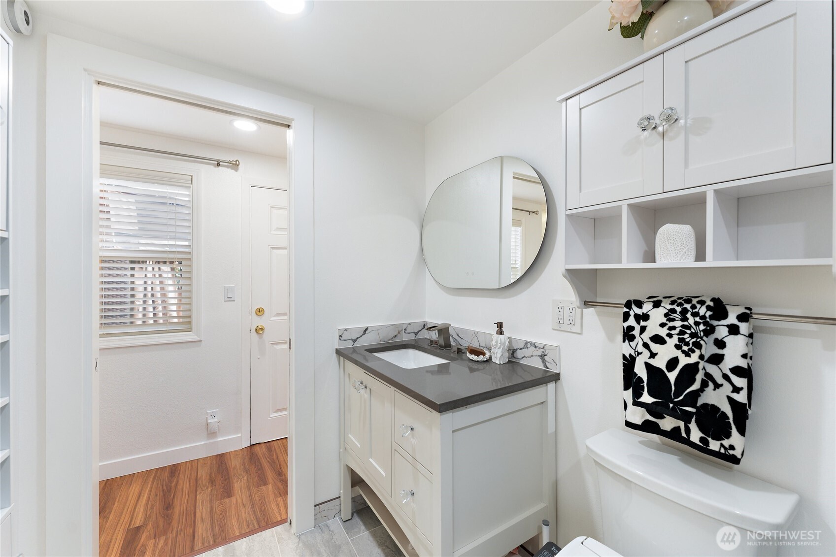 10107 Meridian Avenue Everett, WA 98208 - Photo 10 of 26 a bathroom with a sink a vanity and a mirror