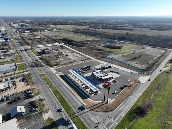 a view of a tennis ground with a city view