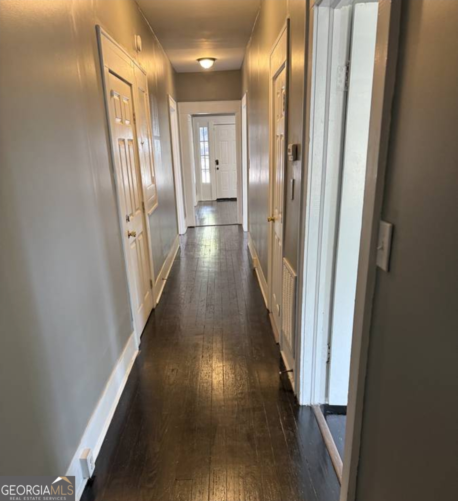 919 Inverness Avenue Macon, GA 31204 - Photo 3 of 9 a view of a hallway with wooden floor