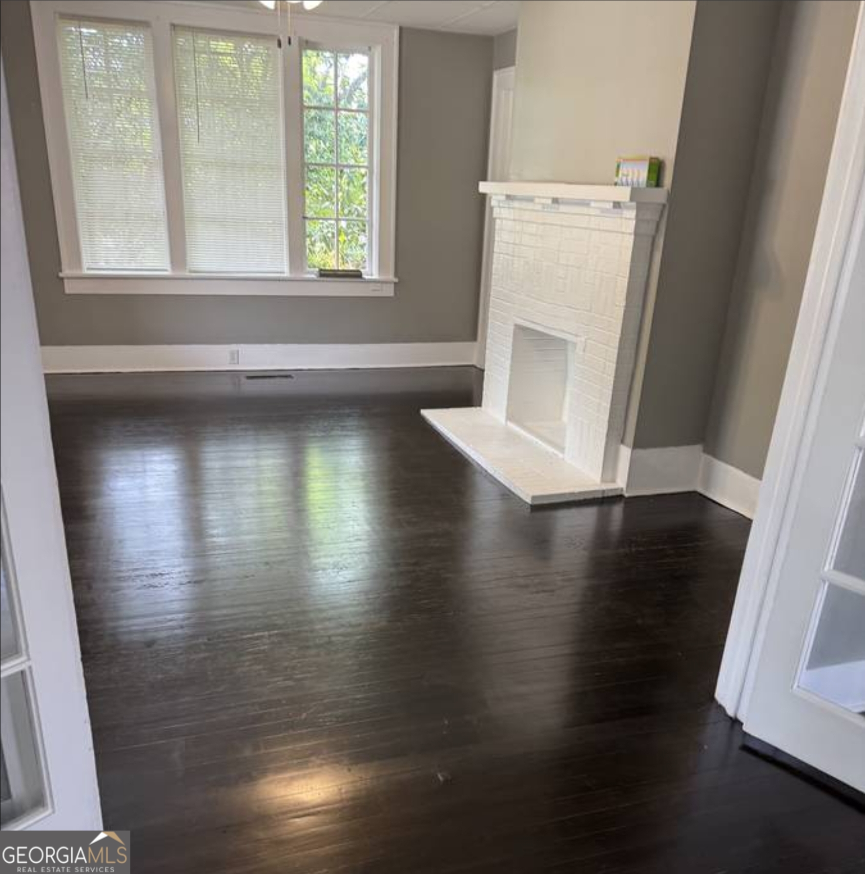 919 Inverness Avenue Macon, GA 31204 - Photo 4 of 9 a view of a living room with a window and wooden floor