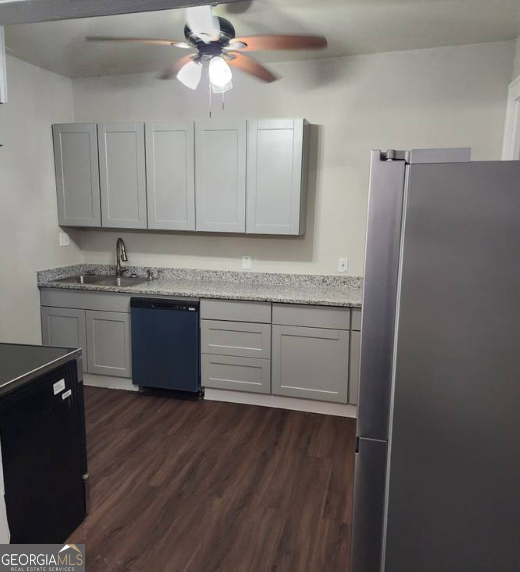 919 Inverness Avenue Macon, GA 31204 - Photo 6 of 9 a kitchen with cabinets and stainless steel appliances