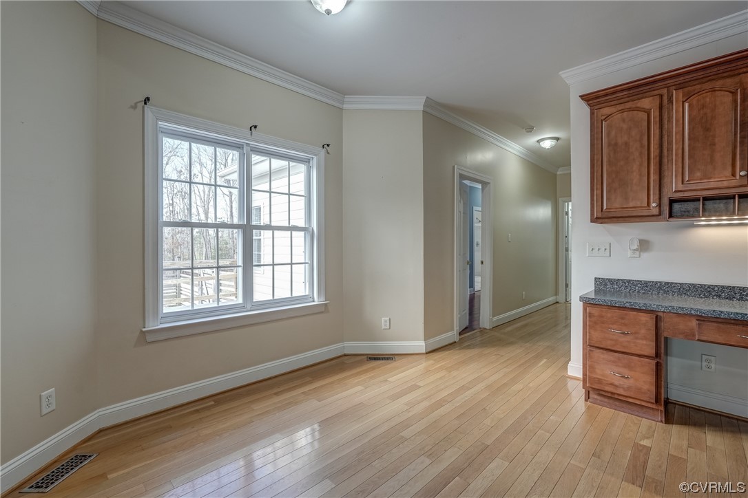 13220 2nd Branch Road Chesterfield, VA 23838 - Photo 18 of 50 an empty room with wooden floor and a cabinet