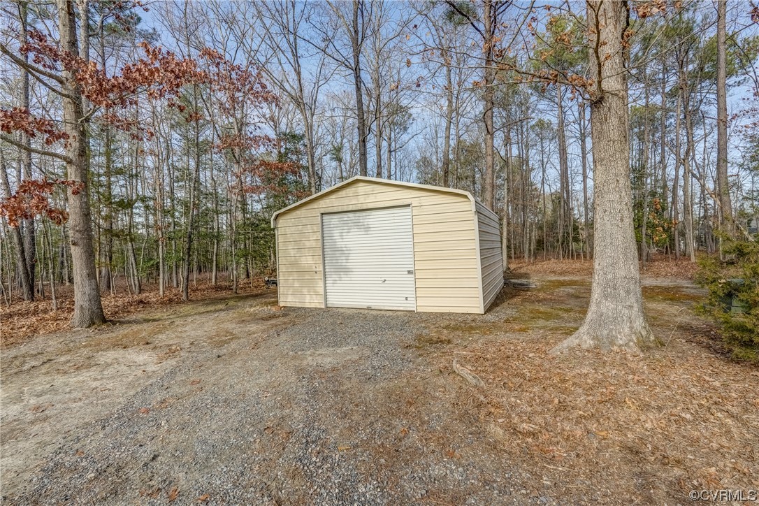 13220 2nd Branch Road Chesterfield, VA 23838 - Photo 47 of 50 a backyard of a house with a stove and large tree