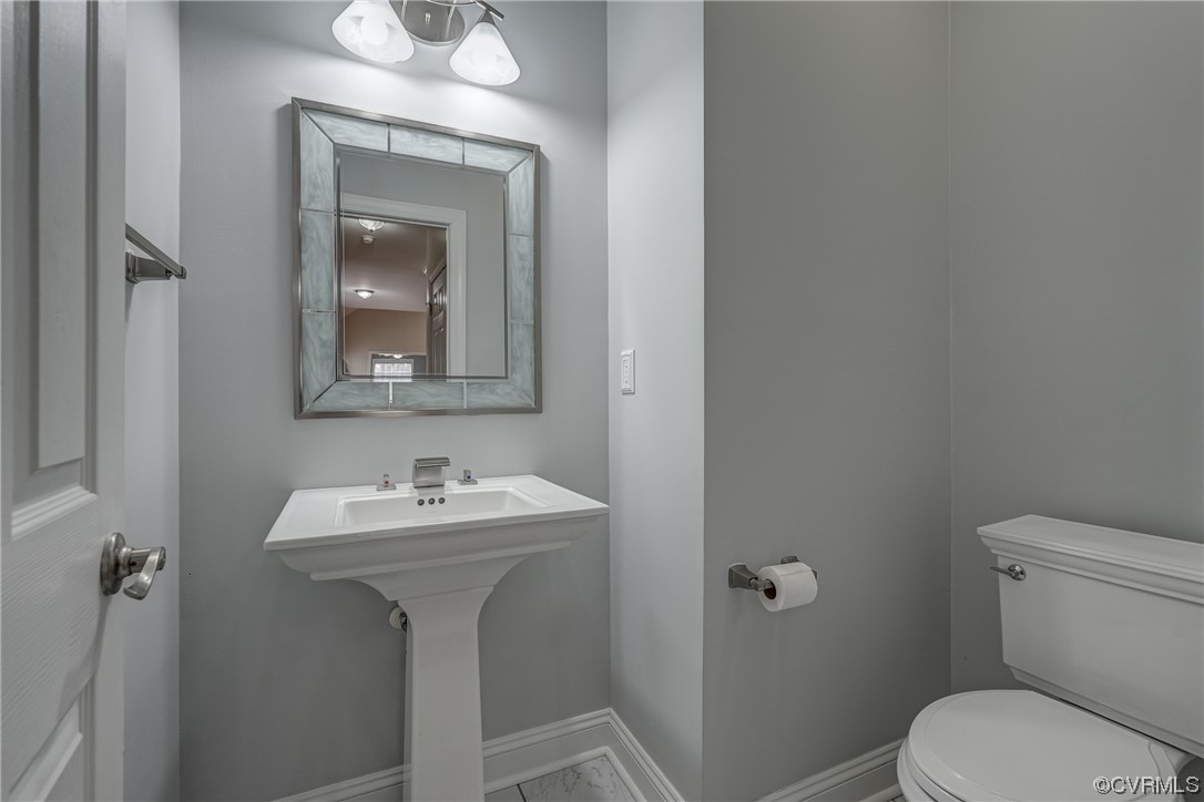 13220 2nd Branch Road Chesterfield, VA 23838 - Photo 8 of 50 a bathroom with a toilet sink and mirror