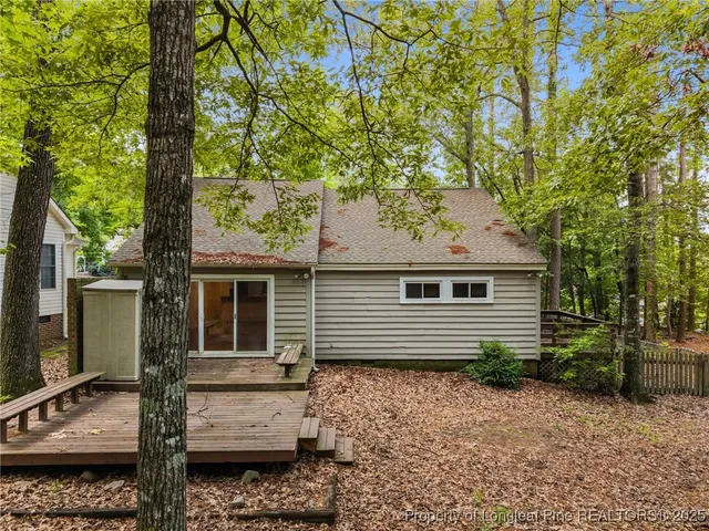 a backyard of a house with barbeque oven