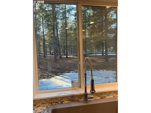 a picture of a room with a floor to ceiling window