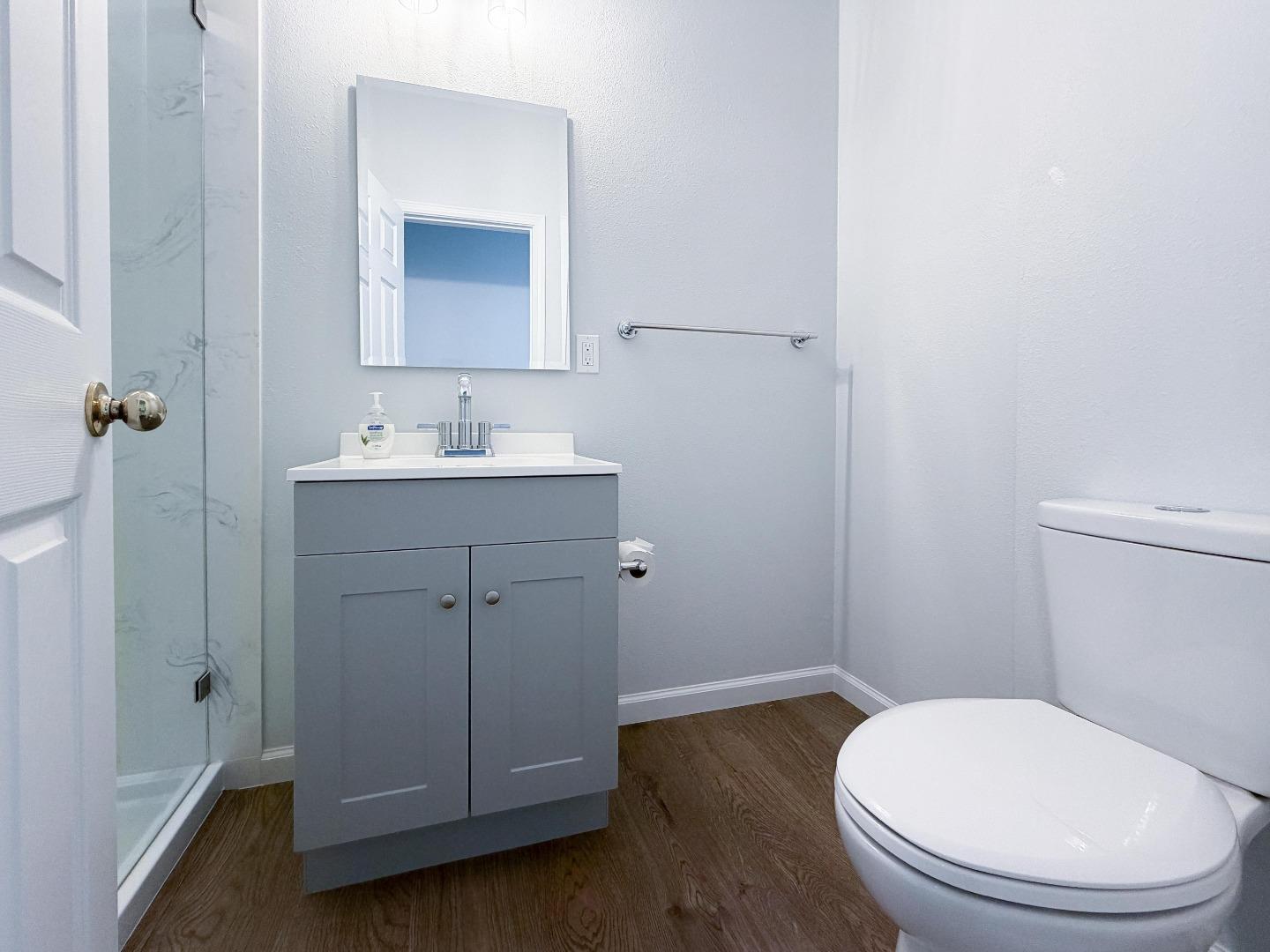 2715 Shellgate Circle Hayward, CA 94545 - Photo 16 of 47 a bathroom with a toilet a sink and mirror