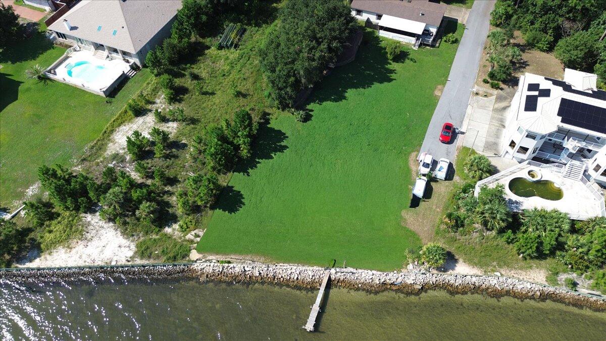 an aerial view of house with yard swimming pool and outdoor seating