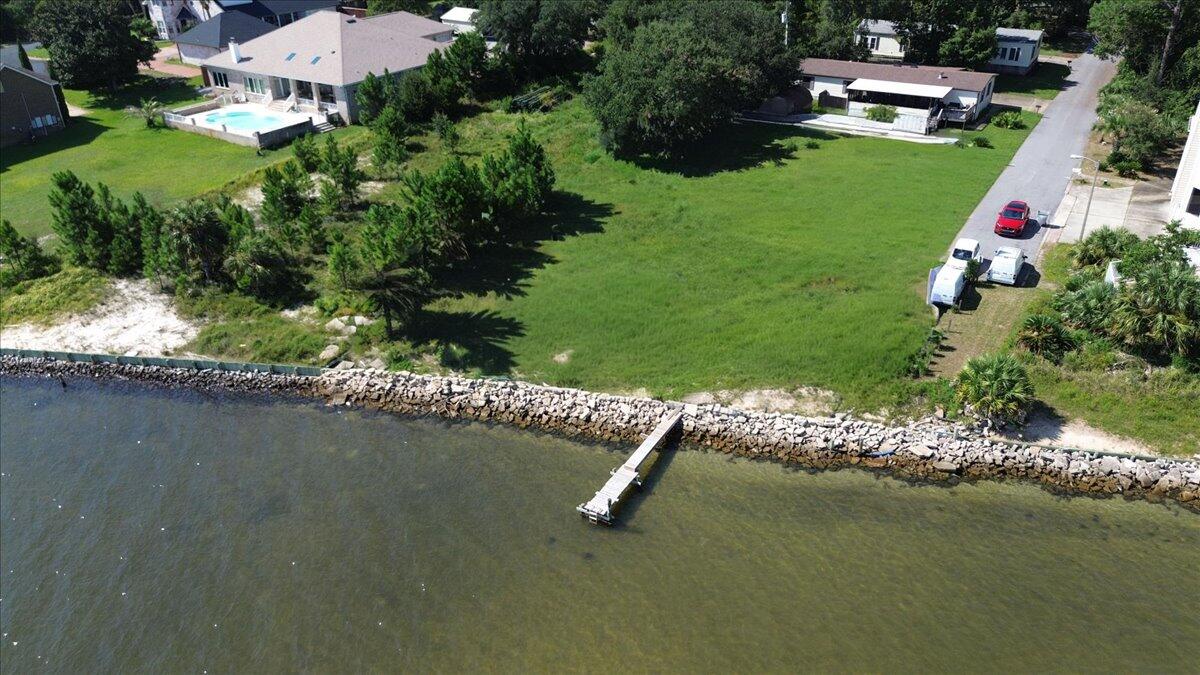 1907 Blankenship Road Navarre, FL 32566 - Photo 13 of 32 an aerial view of a house with a garden and lake view