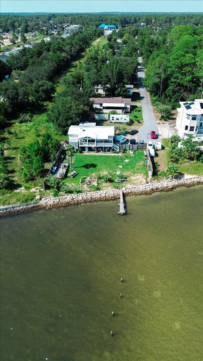 1907 Blankenship Road Navarre, FL 32566 - Photo 15 of 32 a view of a garden with swimming pool
