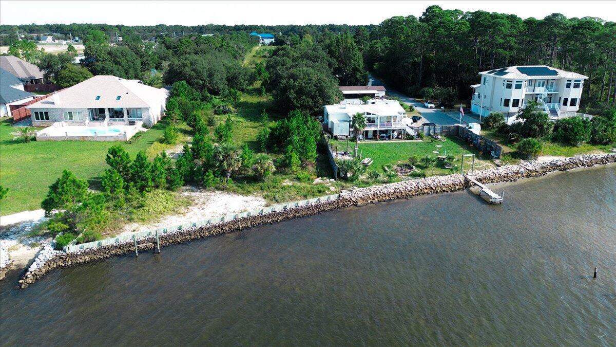 1907 Blankenship Road Navarre, FL 32566 - Photo 16 of 32 an aerial view of a house with a garden and lake view