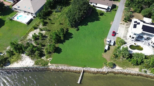an aerial view of house with yard swimming pool and outdoor seating