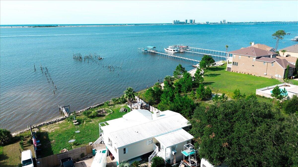 1907 Blankenship Road Navarre, FL 32566 - Photo 22 of 32 a view of a lake with a yard