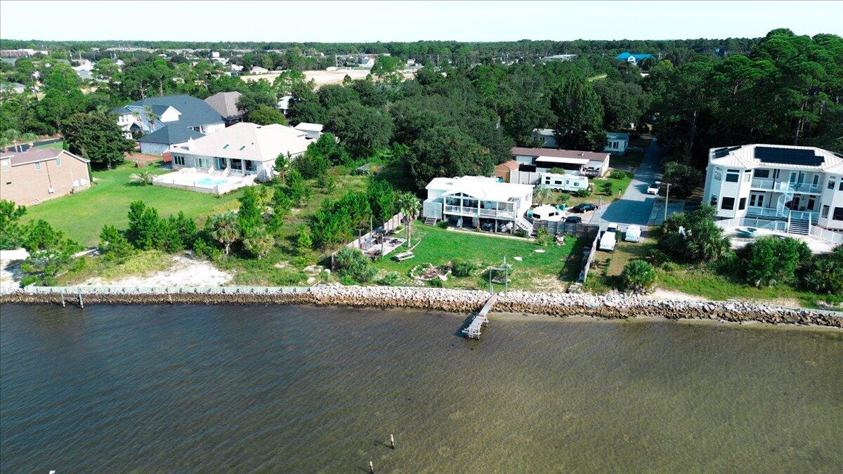 1907 Blankenship Road Navarre, FL 32566 - Photo 23 of 32 an aerial view of a house with a yard basket ball court and outdoor seating