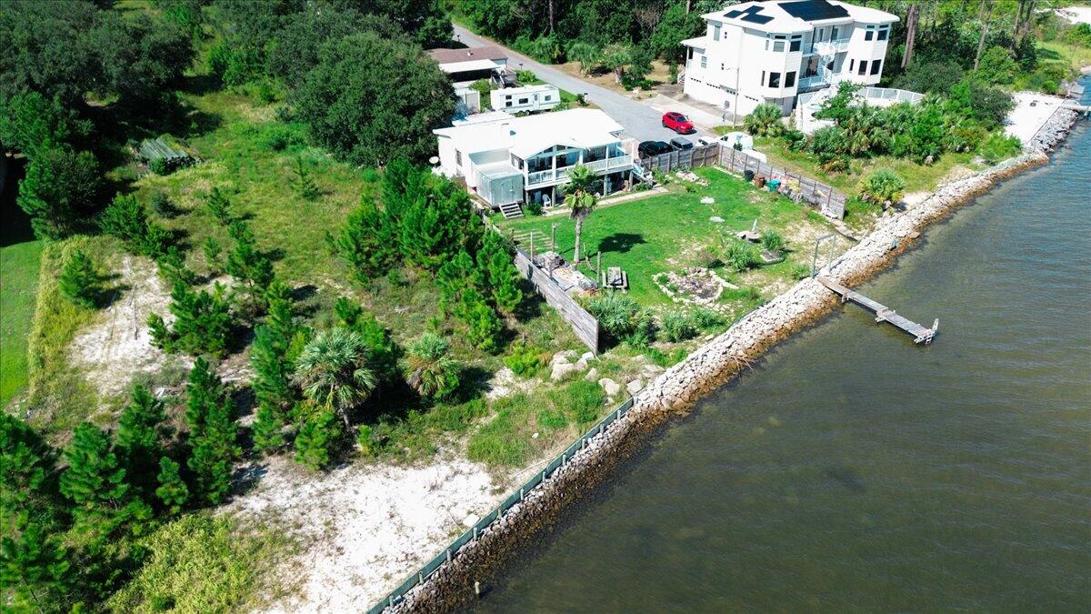 1907 Blankenship Road Navarre, FL 32566 - Photo 27 of 32 an aerial view of residential houses with outdoor space and trees