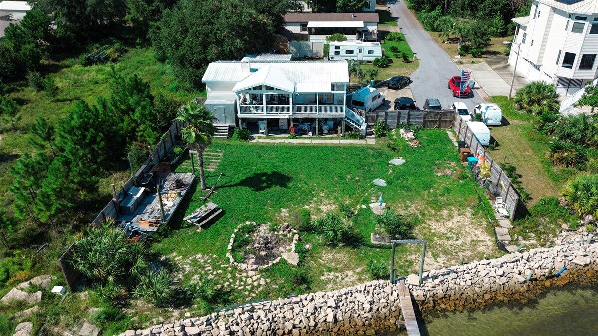 1907 Blankenship Road Navarre, FL 32566 - Photo 4 of 32 a aerial view of a house with a yard and large trees