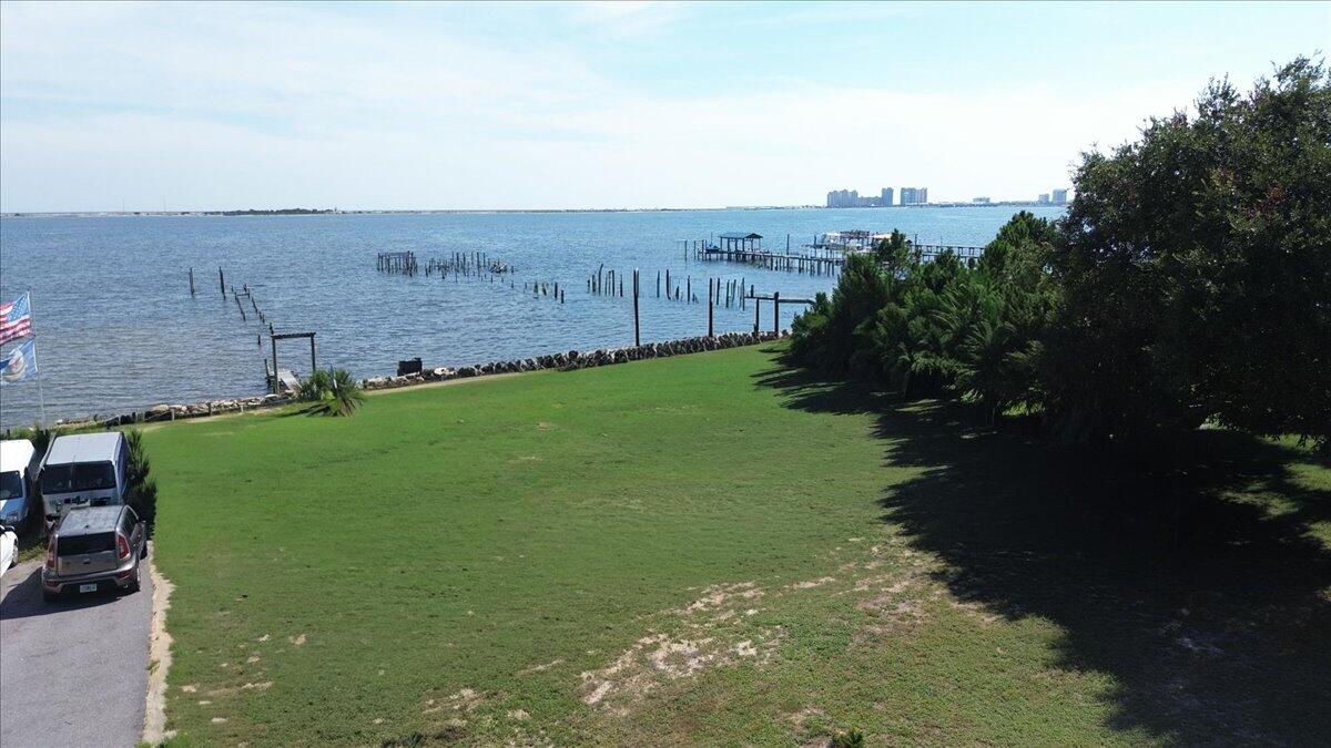 1907 Blankenship Road Navarre, FL 32566 - Photo 8 of 32 a view of a golf course with a lake