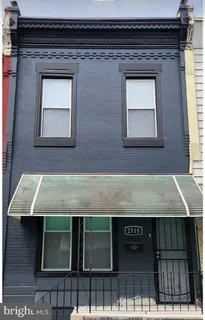 a front view of a house with stairs