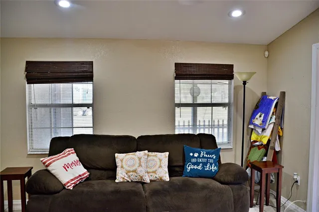 a living room with furniture and a window