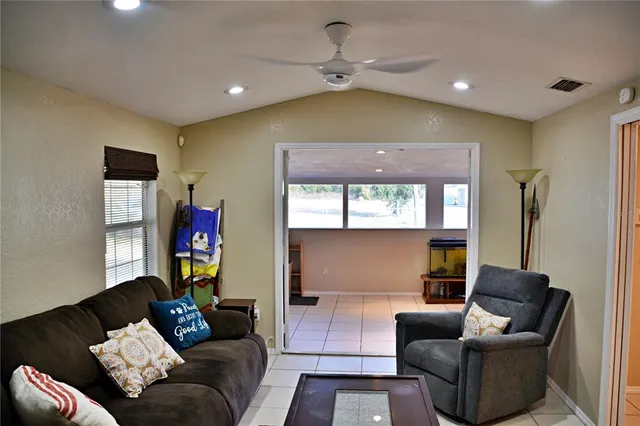 a living room with furniture and a window