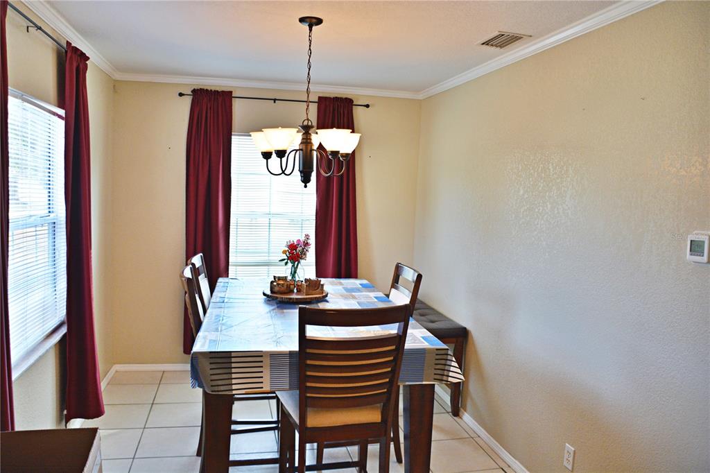 5528 Cherry Road Lakeland, FL 33810 - Photo 16 of 47 a view of a dining room with furniture window and wooden floor