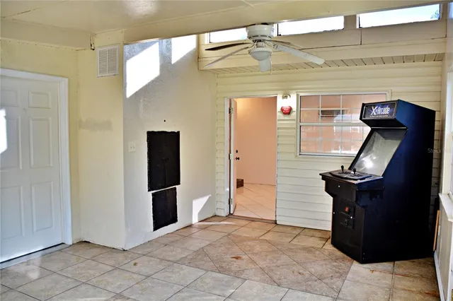 a view of a room that has a bed and a window in it