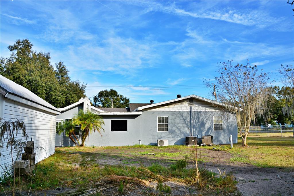 5528 Cherry Road Lakeland, FL 33810 - Photo 33 of 47 a view of a house with backyard and sitting area