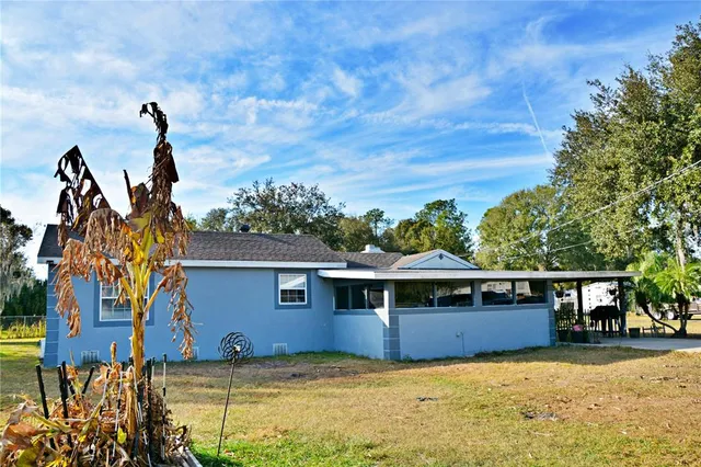 a view of a house with swimming pool