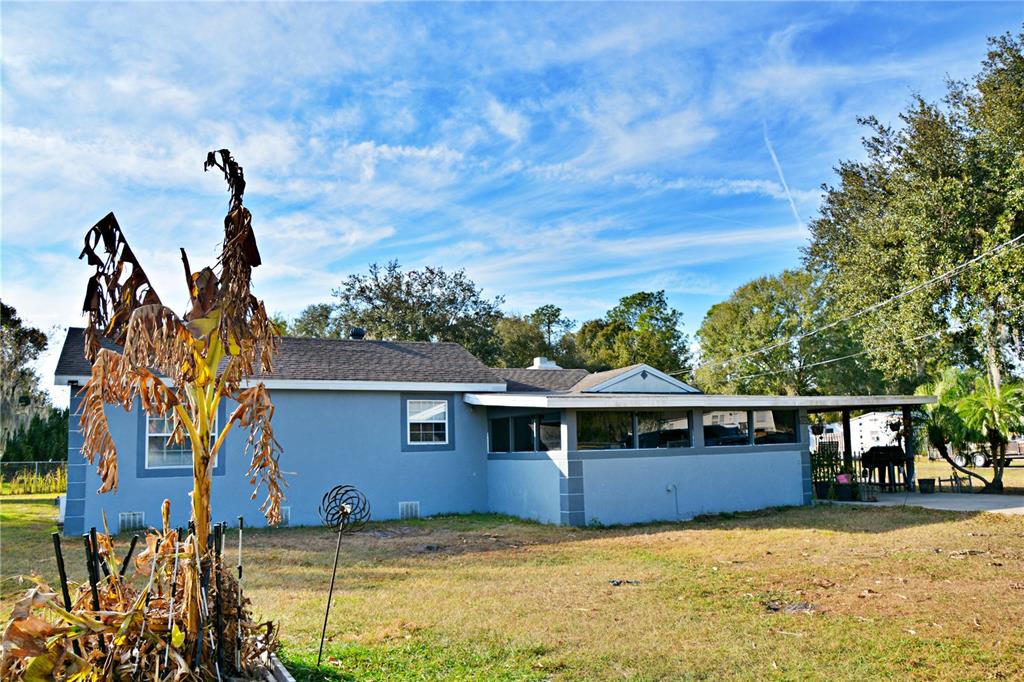 5528 Cherry Road Lakeland, FL 33810 - Photo 38 of 47 a view of a house with a backyard