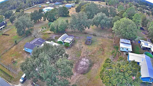 an aerial view of residential house with outdoor space