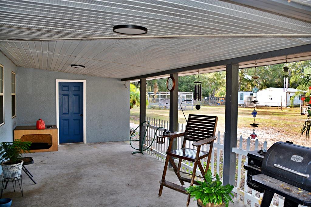 5528 Cherry Road Lakeland, FL 33810 - Photo 7 of 47 a balcony with chairs and with potted plants