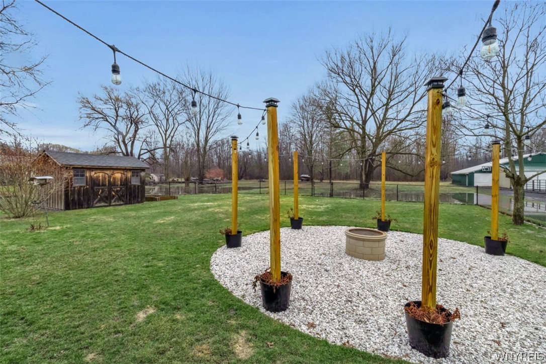 2932 Krueger Road Wheatfield, NY 14120 - Photo 21 of 26 fire pit & shed view