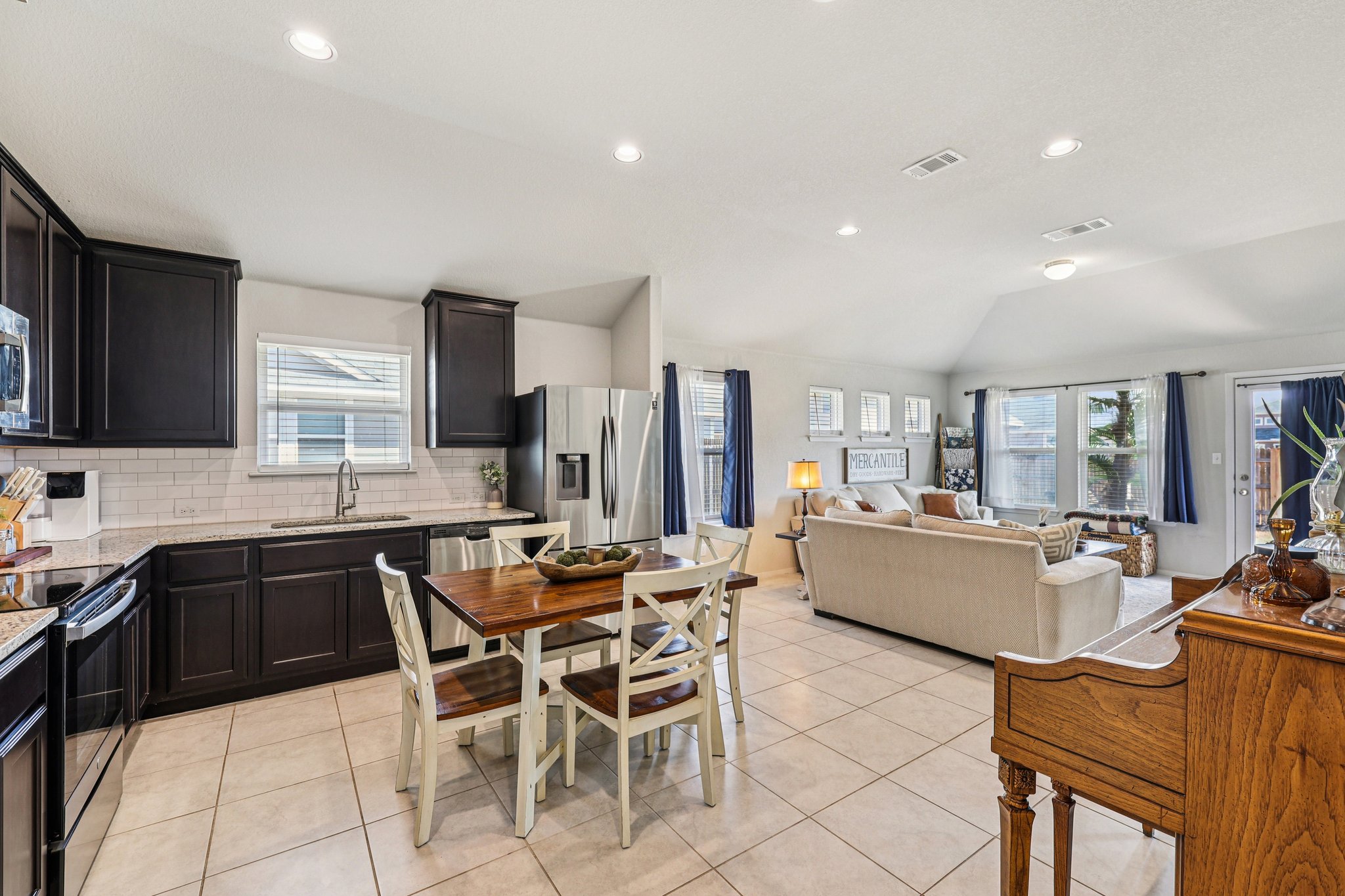 111 Insider Loop Elgin, TX 78621 - Photo 16 of 39 a large kitchen with a table and chairs
