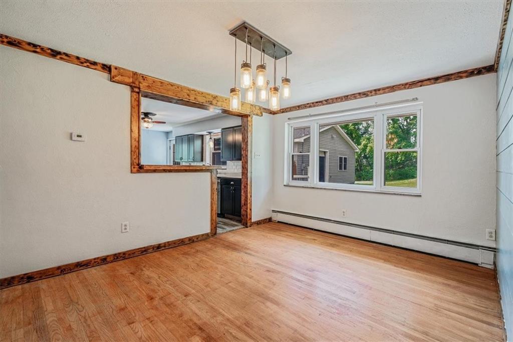 104 Linden Road Canonsburg, PA 15317 - Photo 13 of 48 a view of an empty room with wooden floor and a window