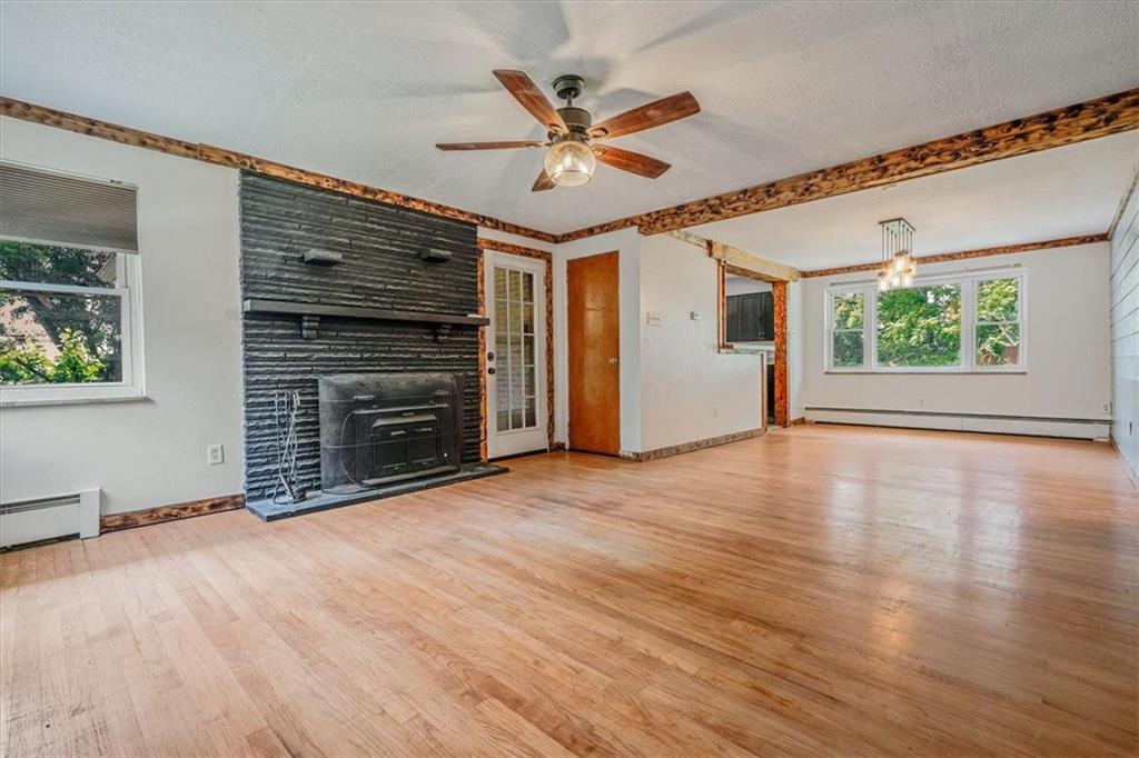 104 Linden Road Canonsburg, PA 15317 - Photo 14 of 48 a view of a livingroom with wooden floor and a ceiling fan
