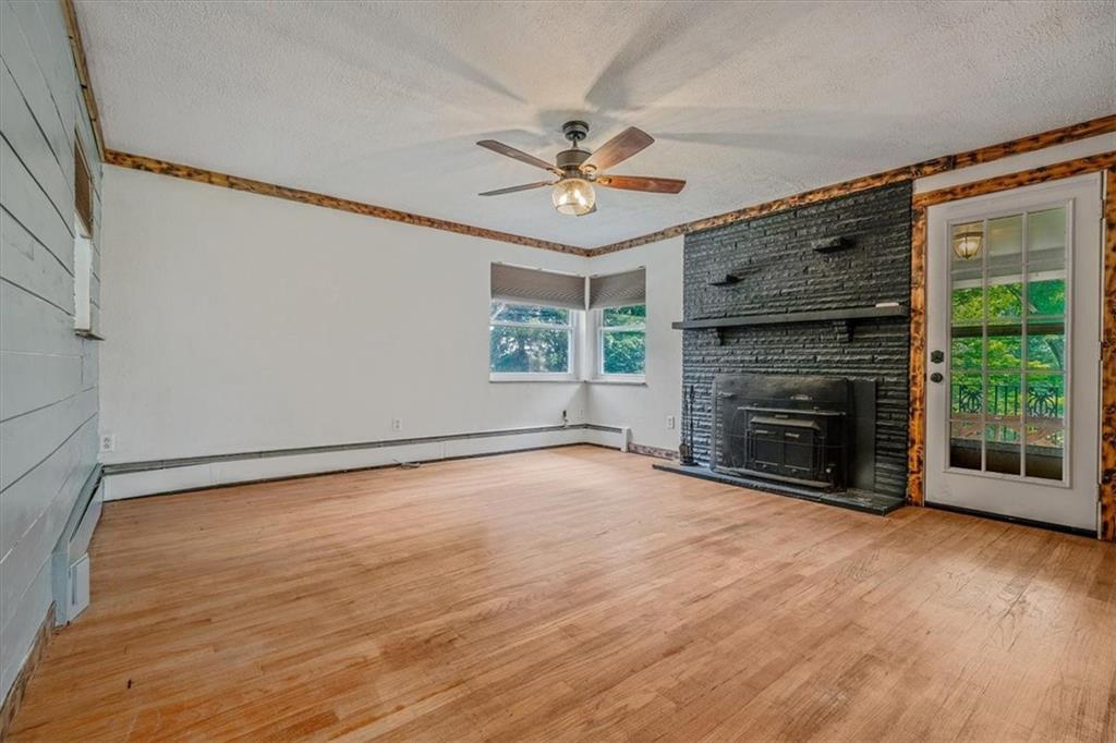 104 Linden Road Canonsburg, PA 15317 - Photo 15 of 48 a view of an empty room with a fireplace and a window