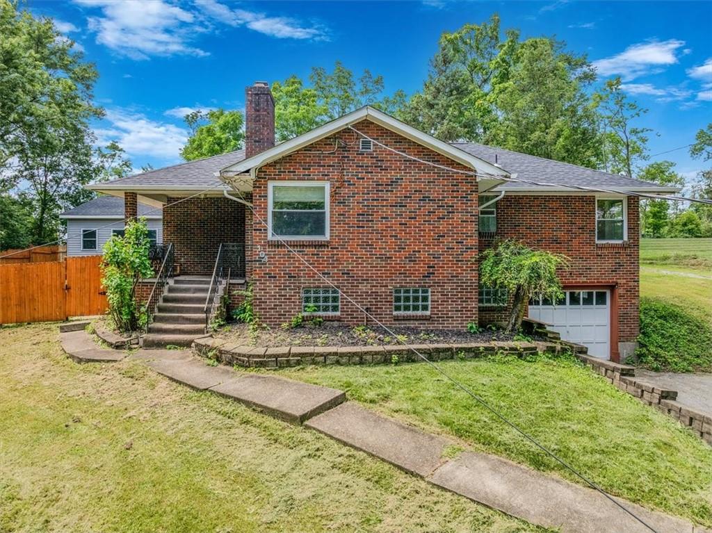 104 Linden Road Canonsburg, PA 15317 - Photo 44 of 48 a front view of house with yard and trees in the background