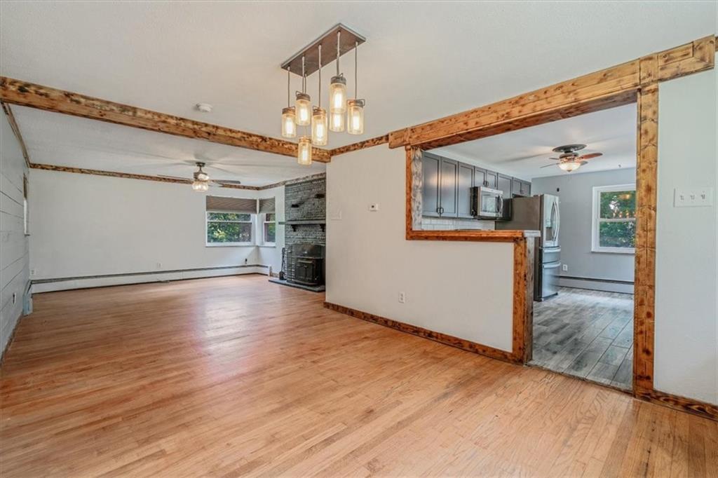 104 Linden Road Canonsburg, PA 15317 - Photo 10 of 48 a view of a big room with wooden floor and chandelier