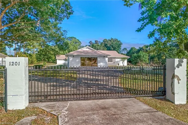 a front view of a house with a fence
