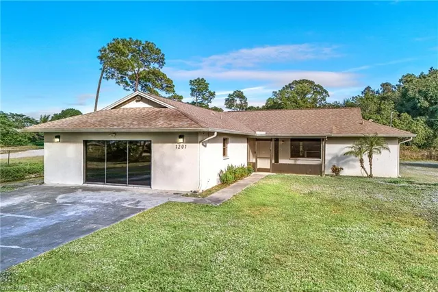 front view of a house with a yard