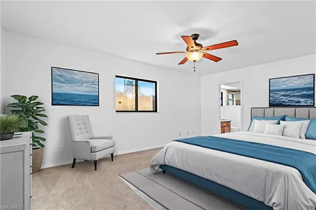 a bedroom with a bed a rug and a potted plant