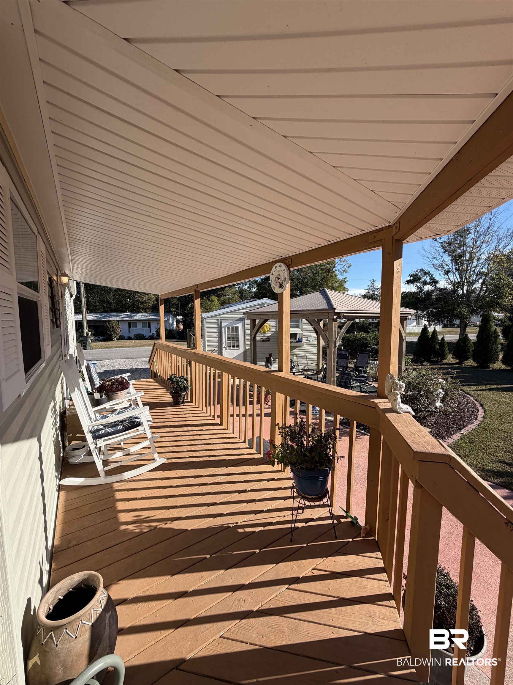 675 Escambia Loop Lillian, AL 36549 - Photo 8 of 44 Wooden deck featuring an outdoor structure
