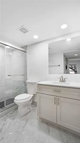 an empty room with wooden floor and window