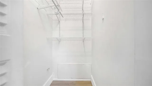 a bathroom with a shower sink vanity mirror and toilet